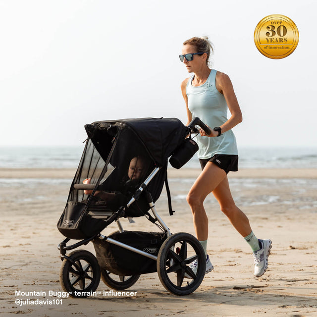 mom and toddler training at the beach using our terrain active stroller - Mountain Buggy terrain™ influencer, @juliadavis101