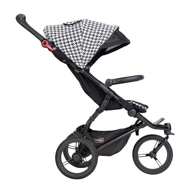 Mountain Buggy swift luxury collection stroller in pepita white and black checkered colour with extendable sunhood side view_pepita