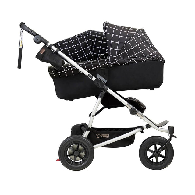 mountain buggy duet double buggy with one carrycot plus in incline mode side view shown in color grid_grid