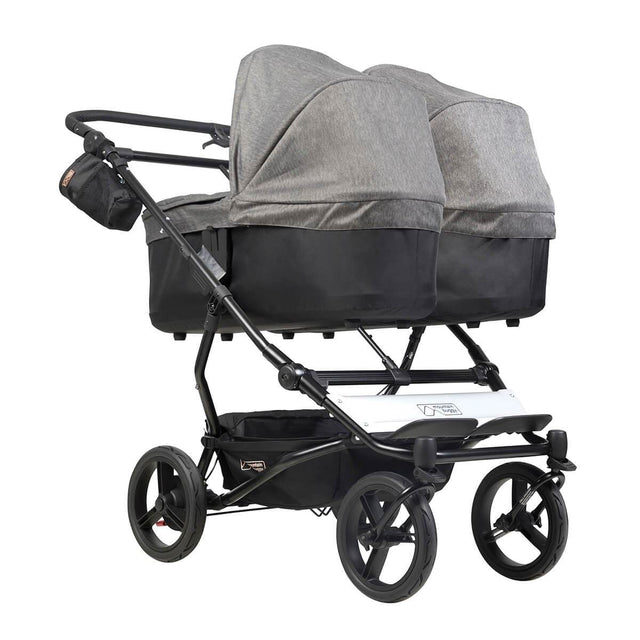 mountain buggy duet double buggy with two carrycot plus in lie flat mode 3/4 view shown in color herringbone_herringbone